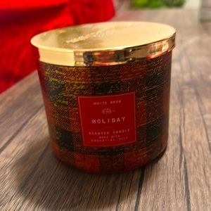 Bath and Body works candle . Name: Holiday.